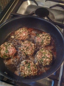 image of lamb kofte's frying in pan